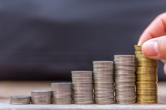 Coins stacked up in a row.