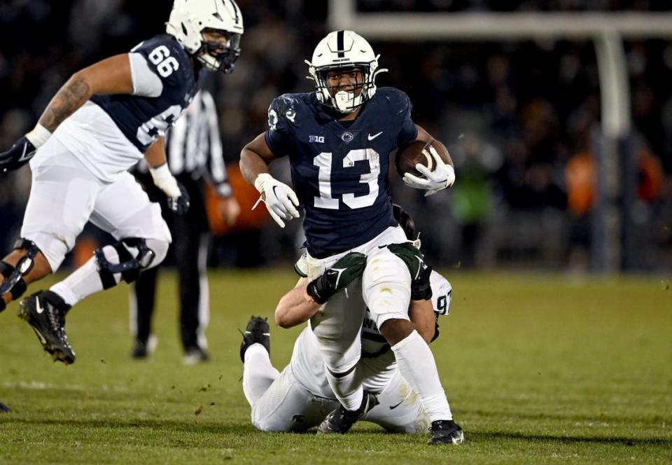 Michigan State defenders try to stop Penn State running back Kaytron Allen during the game on Saturday, Nov. 26, 2022.