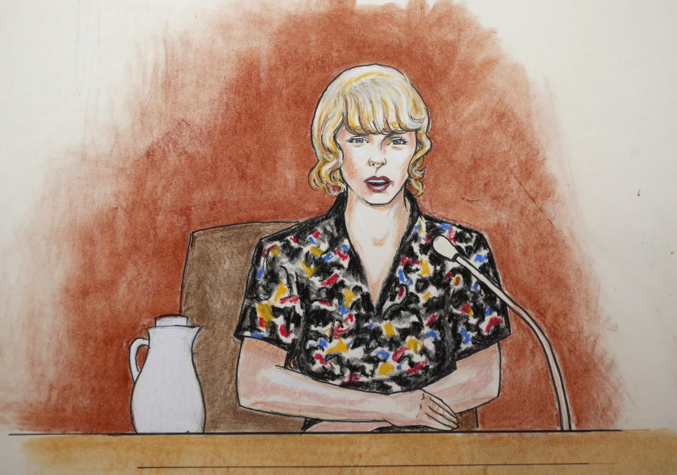 In this courtroom sketch, Taylor Swift speaks from the witness stand during the trial on Aug. 10, in Denver.