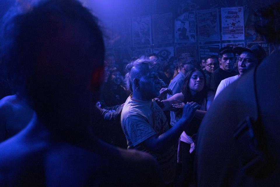 Fans of the Mexican Punk Rock band Seguimos Perdiendo dance during one of the last active weekends at the iconic counterculture venue Multiforo Alicia in Mexico City, Friday, Feb. 17, 2023. The Alicia considers itself as the only libertarian, anarchist, self-managed space in Mexico City. (AP Photo/Eduardo Verdugo)