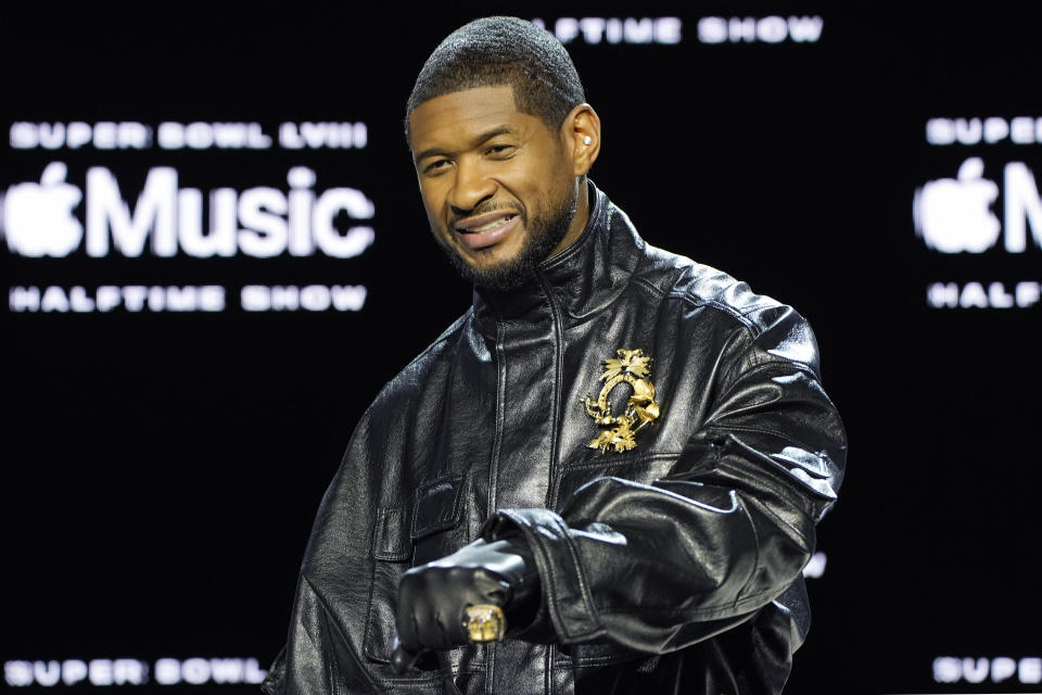 Usher poses for photographers during a news conference ahead of the Super Bowl 58 NFL football game Thursday, Feb. 8, 2024, in Las Vegas. Usher will perform during the Super Bowl halftime show. (AP Photo/John Locher)