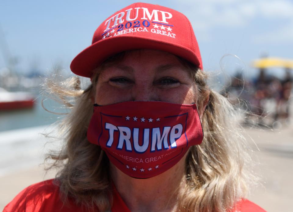 Mary Delany wears a Trump hat and mask at a gathering, Saturday, July 11, 2020, at the Selena Memorial statue. Delany came with her husband and two dogs. 