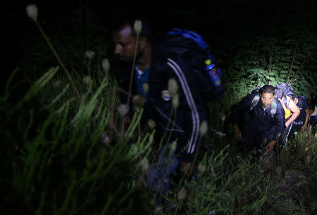 Migrants try to enter Bosnia from Serbia through the border near Zvornik, Bosnia and Herzegovina August 31, 2018. Picture taken August 31, 2018. REUTERS/Dado Ruvic