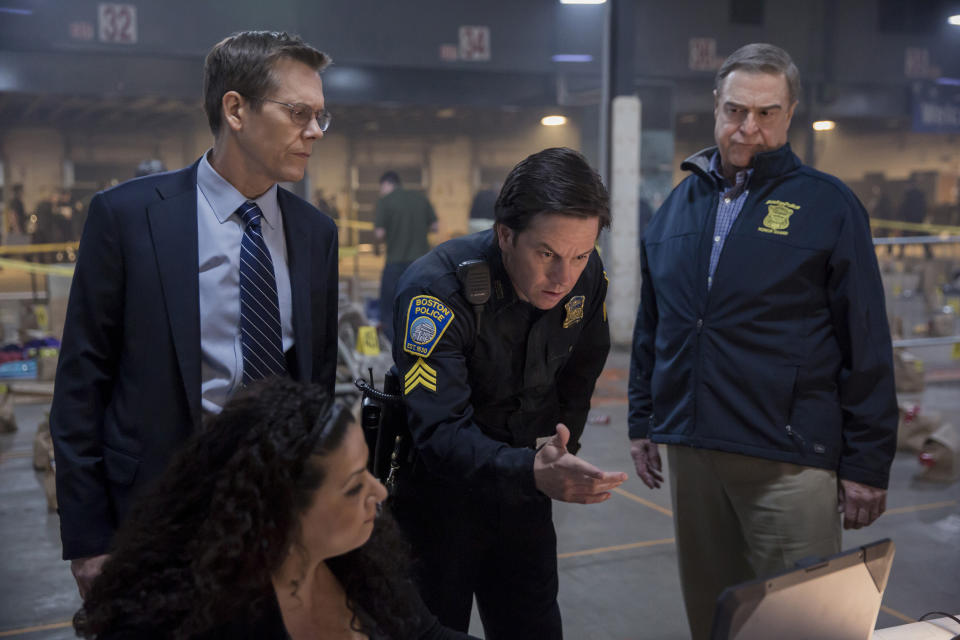 In this image released by CBS Films, Kevin Bacon, standing from left, Mark Wahlberg and John Goodman appear in a scene from "Patriots Day." (Karen Ballard/CBS Films and Lionsgate Films via AP)