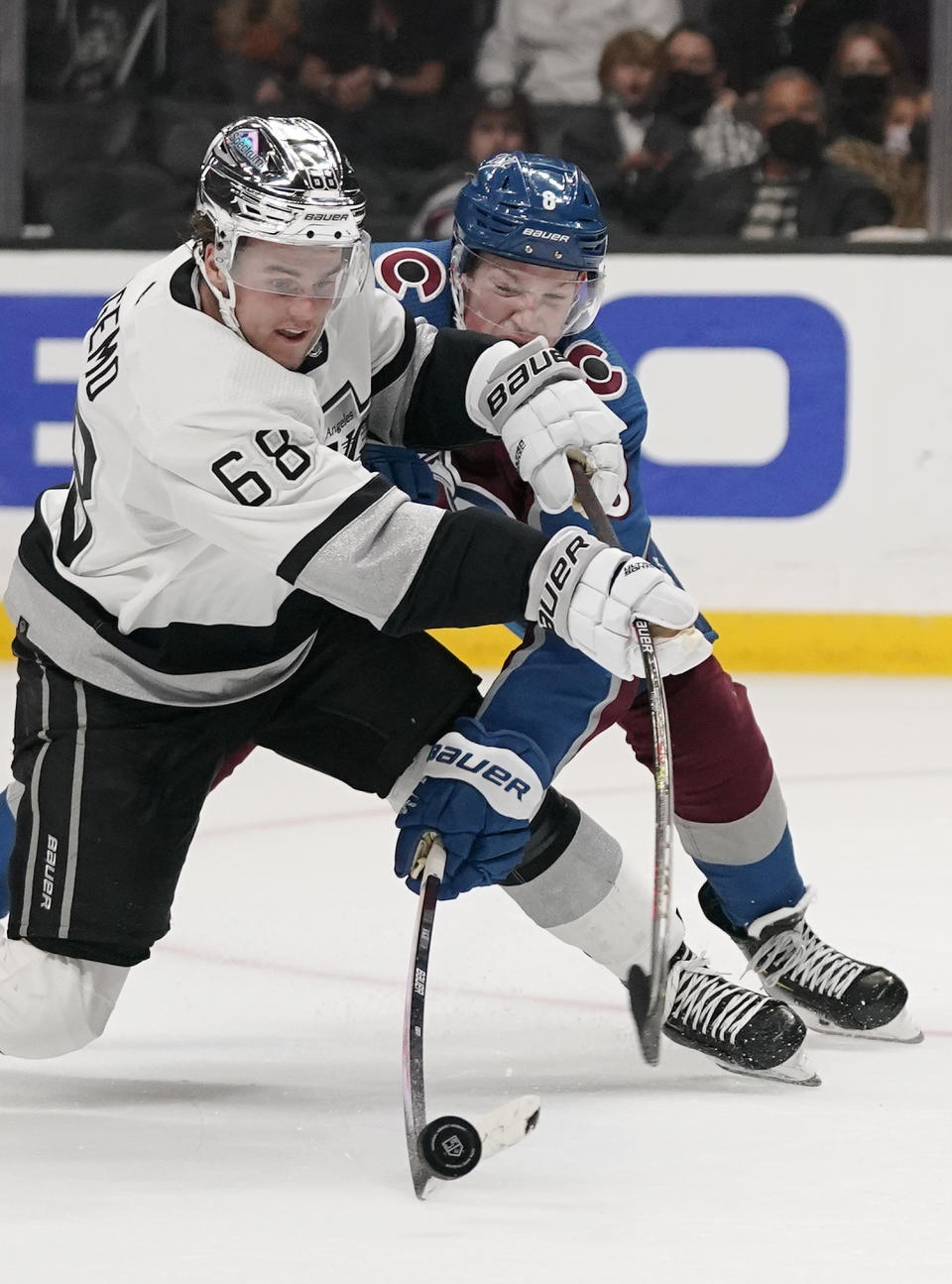 Colorado Avalanche defenseman Cale Makar, right, stops a shot by Los Angeles Kings right wing Samuel Fagemo during the second period of an NHL hockey game Thursday, Jan. 20, 2022, in Los Angeles. (AP Photo/Mark J. Terrill)