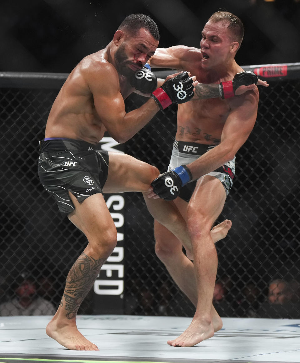 Dan Ige, left, and Nate Landwehr fight during a featherweight bout at UFC 289 in Vancouver, British Columbia on Saturday, June 10, 2023. (Darryl Dyck/The Canadian Press via AP)