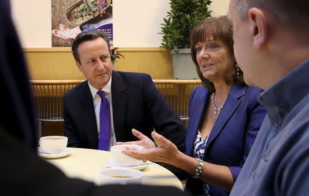 Britain's Prime Minister David Cameron (L) and Ros Altmann (C) at a garden centre cafe in Birmingham, England, April 17, 2015. REUTERS/Peter Macdiarmid/Pool