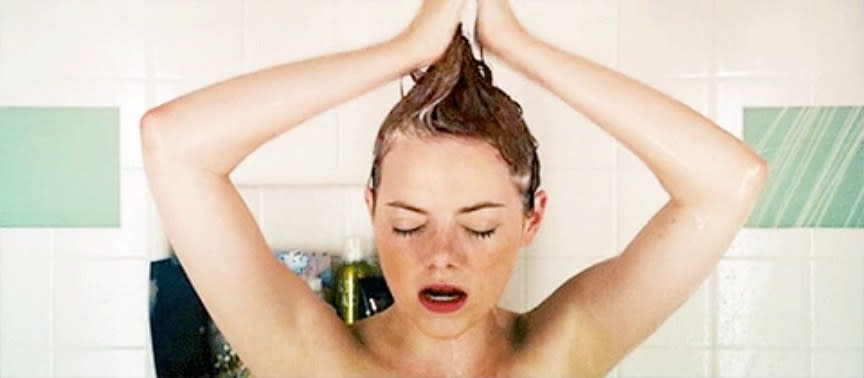 Woman washing her hair in the shower