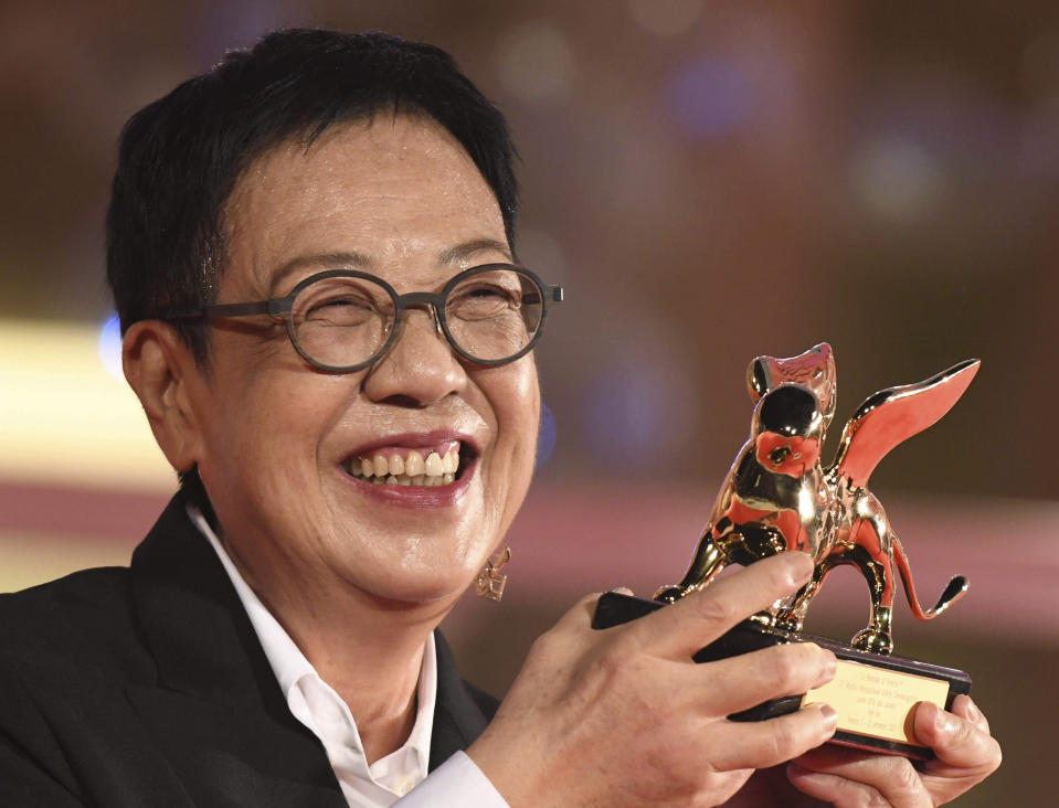 Director Ann Hui holds her Golden Lion award for Lifetime Achievement during the 77th edition of the Venice Film Festival in Venice, Italy, Tuesday, Sept. 8, 2020.(Piergiorgio Pirrone /LaPresse via AP)