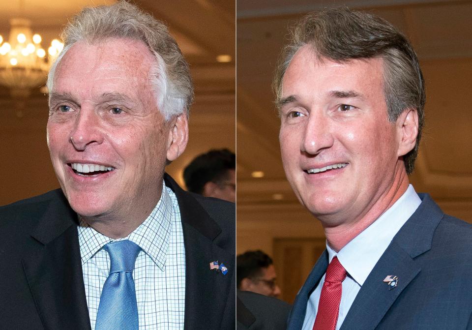 Democratic former Gov. Terry McAuliffe, left, and Republican Glenn Youngkin attend the Virginia FREE leadership luncheon in McLean on Sept. 1.