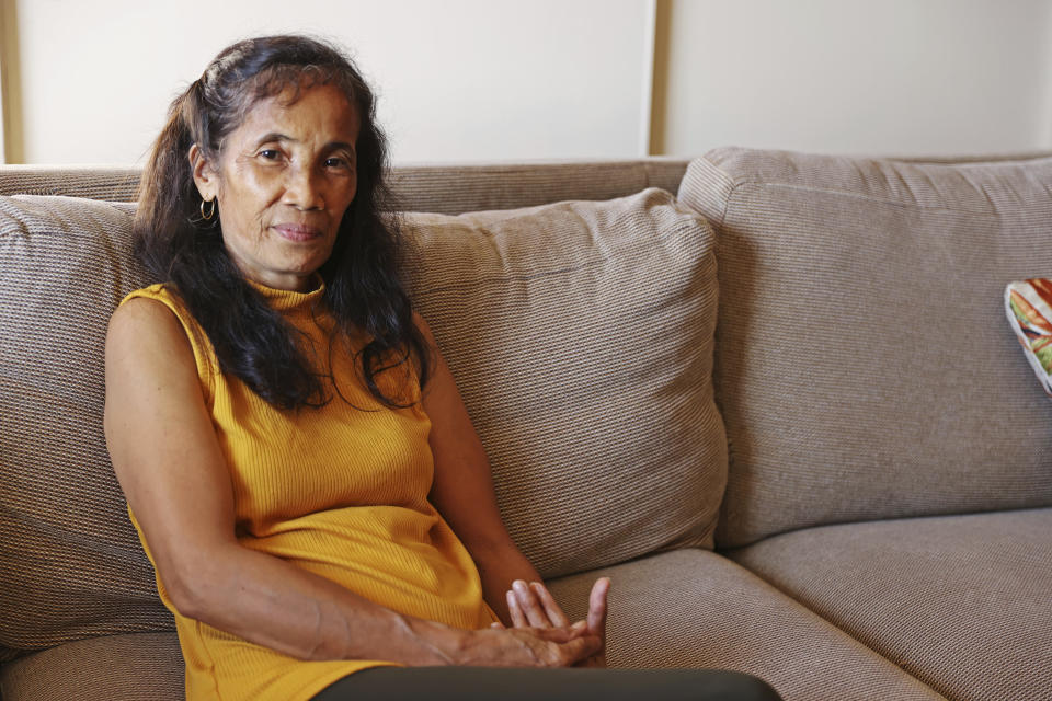 Elsie Rosales sits inside a hotel condo after her home burned down in Lahaina during the Hawaii wildfires, Friday, Sept. 1, 2023, in Kahana, Hawaii. (AP Photo/Marco Garcia)