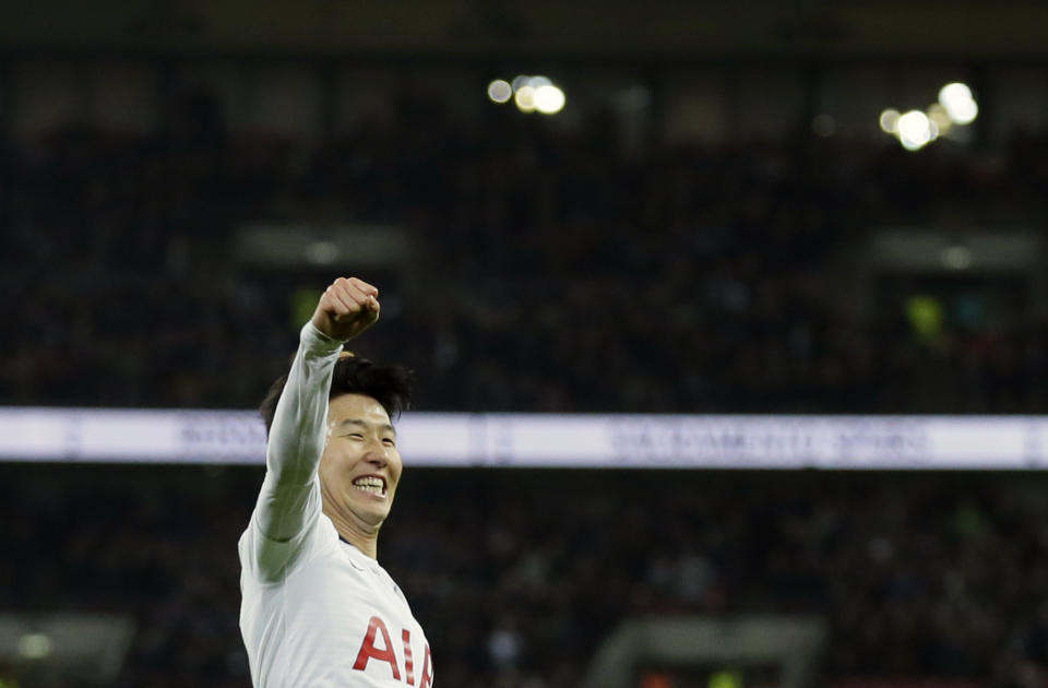 Tottenham's Heung-Min Son celebrates after scoring his side's fifth goal during the English Premier League soccer match between Tottenham Hotspur and Bournemouth at Wembley stadium in London, Wednesday, Dec. 26, 2018. (AP Photo/Tim Ireland)