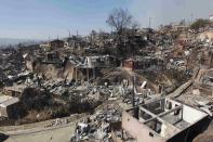 A general view of the place where a forest fire burned several neighbourhoods in the hills in Valparaiso city, northwest of Santiago, April 13, 2014. At least 11 people were killed and 500 houses destroyed over the weekend by a fire that ripped through parts of Chilean port city Valparaiso, as authorities evacuated thousands and used aircraft to battle the blaze. REUTERS/Eliseo Fernandez (CHILE - Tags: SOCIETY ENVIRONMENT DISASTER)