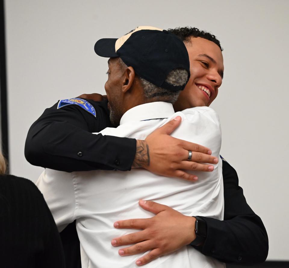 Brandon Clark hugs his father, Willie Clark, after being pinned into the South Bend Police Department on May 15, 2024.