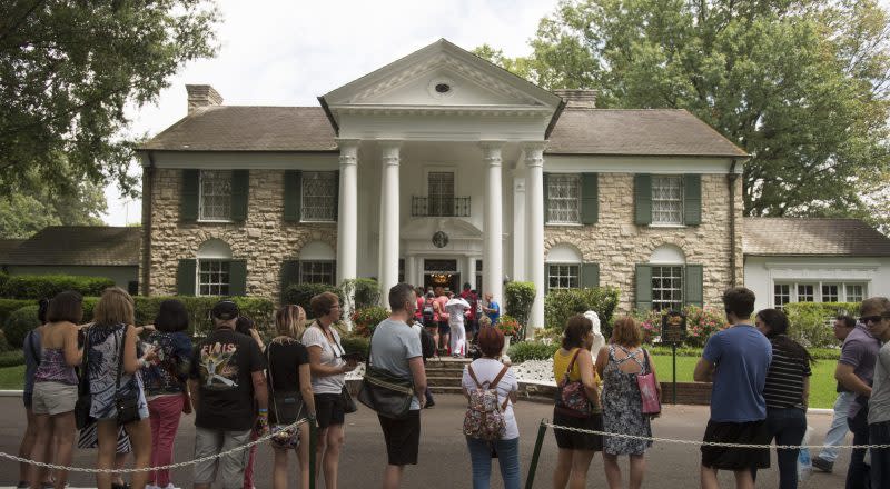 Fans wait in line outside Graceland Tuesday, Aug. 15, 2017, in Memphis, Tenn. The granddaughter of Elvis Presley is fighting plans to publicly auction his Graceland estate in Memphis after a company tried to sell the property based on claims that a loan using the king of rock ’n’ roll's former home as collateral was not repaid. A public auction for the estate had been scheduled for Thursday, May 23, 2024, but a Memphis judge blocked the sale after Presley’s granddaughter Riley Keough sought a temporary restraining order and filed a lawsuit, court documents show. (AP Photo/Brandon Dill, File)