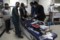 An Afghan school student is treated at a hospital after a bomb explosion near a school west of Kabul, Afghanistan, Saturday, May 8, 2021. A bomb exploded near a school in west Kabul on Saturday, killing several people, many them young students, an Afghan government spokesmen said. (AP Photo/Rahmat Gul)