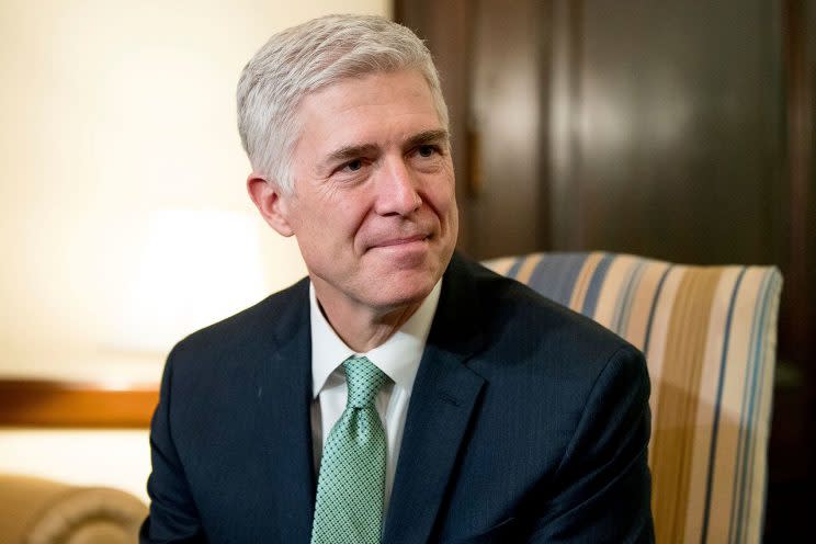 In a Feb. 14, 2017, file photo, Supreme Court Justice nominee Neil Gorsuch meets with Sen. Chris Coons, D-Del. on Capitol Hill in Washington. Gorsuch is roundly described by colleagues and friends as a silver-haired combination of wicked smarts, down-to-earth modesty, disarming warmth and careful deliberation. His critics largely agree with that view of the self-described “workaday judge” in polyester robes. Even so, they’re not sure it’s enough to warrant giving him a spot on the court. (AP Photo/Andrew Harnik, File)