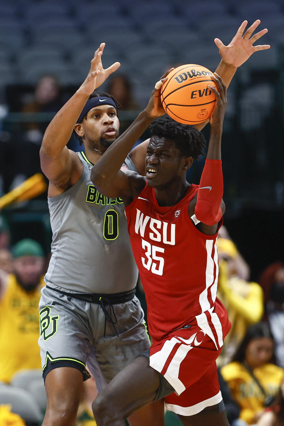 Washington State forward Mouhamed Gueye (35) battles Baylor forward Flo Thamba (0) for space during the first half of an NCAA college basketball game on Sunday, Dec. 18, 2022, in Dallas. (AP Photo/Brandon Wade)