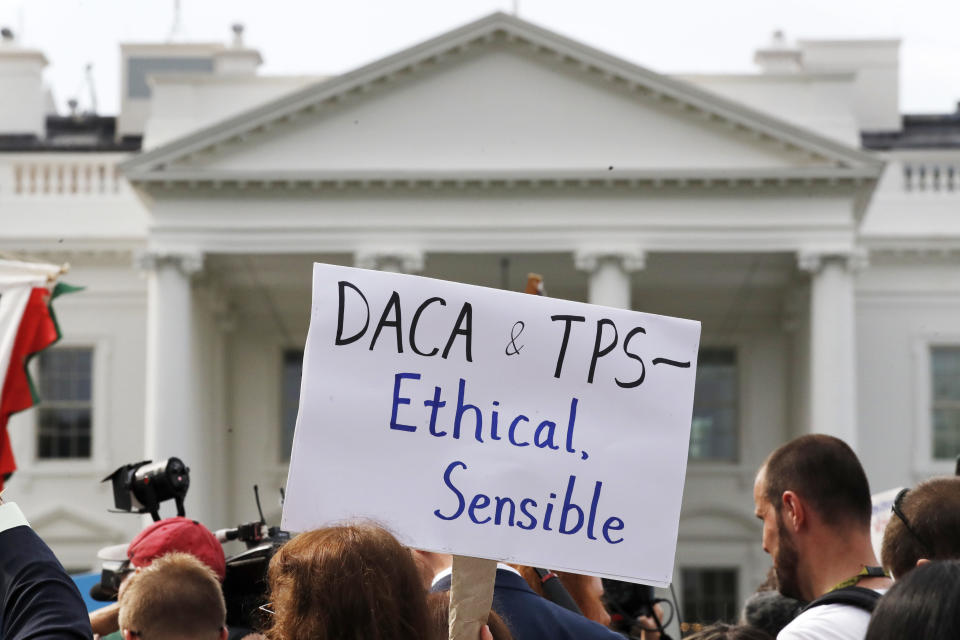 A person holds up a sign in support of the Deferred Action for Childhood Arrivals, known as DACA, and Temporary Protected Status programs during a rally in support of DACA and TPS outside of the White House, in Washington, Tuesday, Sept. 5, 2017. President Donald Trump’s administration will “wind down” a program protecting hundreds of thousands of young immigrants who were brought into the country illegally as children, Attorney General Jeff Sessions declared Tuesday, calling the Obama administration’s program “an unconstitutional exercise of authority.” (AP Photo/Jacquelyn Martin)