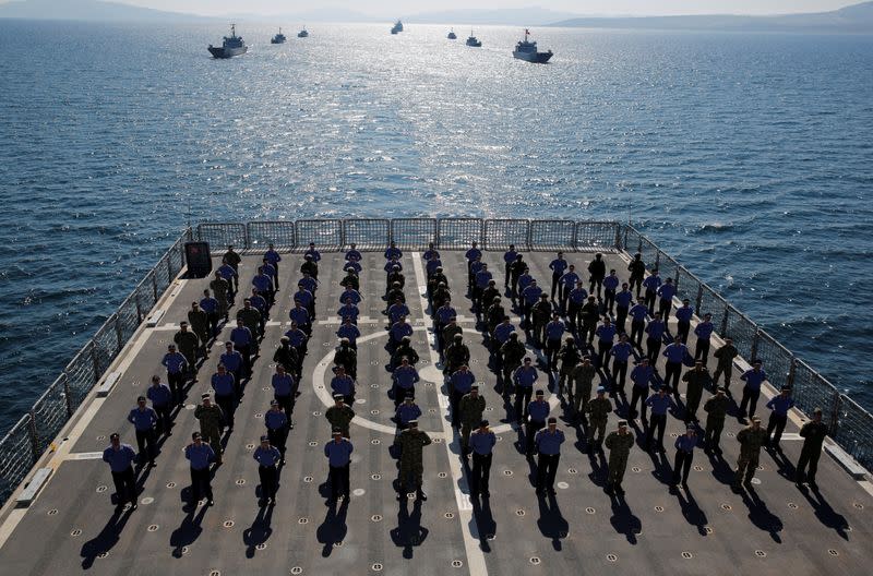 FILE PHOTO: Crew members of the amphibious landing ship tank (LST) TCG Bayraktar (L-402) pose after a landing drill during the Blue Homeland naval exercise off the Aegean coastal town of Foca in Izmir Bay