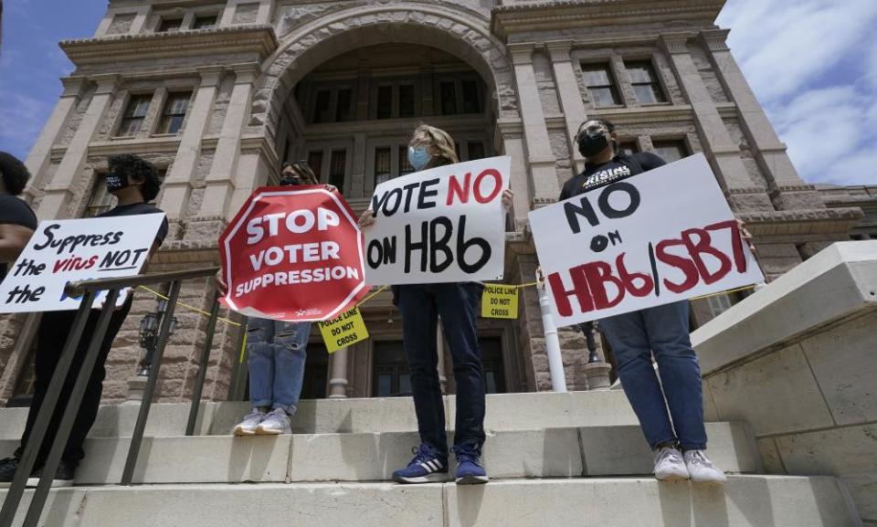 People protest against the HB6 and SB7 voter bills in Texas. Republican lawmakers around the country are pressing ahead with efforts to tighten voting laws, despite growing warnings from business leaders that the measures could harm democracy and the economic climate.