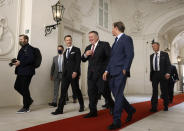 U.S. Secretary of State Mike Pompeo, center, Austrian Finance Minister Gernot Bluemel, second left, and U.S. ambassador to Austria Trevor Traina, second right, arrive for a business roundtable at the Winter Palace in Vienna Austria, Friday Aug. 14, 2020. Pompeo is on a five-day visit to central Europe. (Lisi Niesner/Pool via AP)