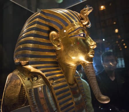 The mask of King Tutankhamun, which was found to have been damaged and glued back together, is seen at the Egyptian Museum in Cairo January 24, 2015. REUTERS/Staff