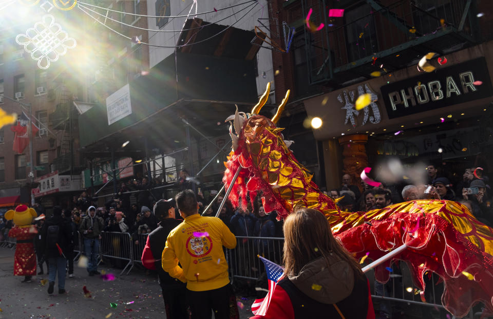 Revelers participate during the Lunar New Year parade in Chinatown in New York, Sunday, Feb. 9, 2020. (AP Photo/Craig Ruttle)