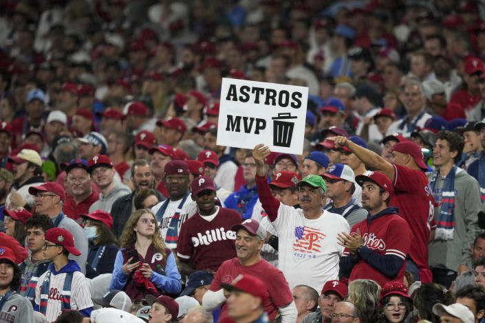 A fans hold a sign during the fourth inning in Game 3 of baseball's World Series between the Houston Astros and the Philadelphia Phillies on Tuesday, Nov. 1, 2022, in Philadelphia. (AP Photo/Matt Slocum)