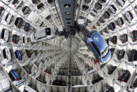 FILE - In this April 28, 2016 file photo Volkswagen cars are presented to media inside a delivery tower n Wolfburg, Germany. Germany's Federal Court has ruled Volkswagen must buy back cars from owners who bought vehicles rigged to cheat in emissions tests but consumers must accept current value taking into account the mileage they drove rather than the full purchase price. (AP Photo/Markus Schreiber, File)