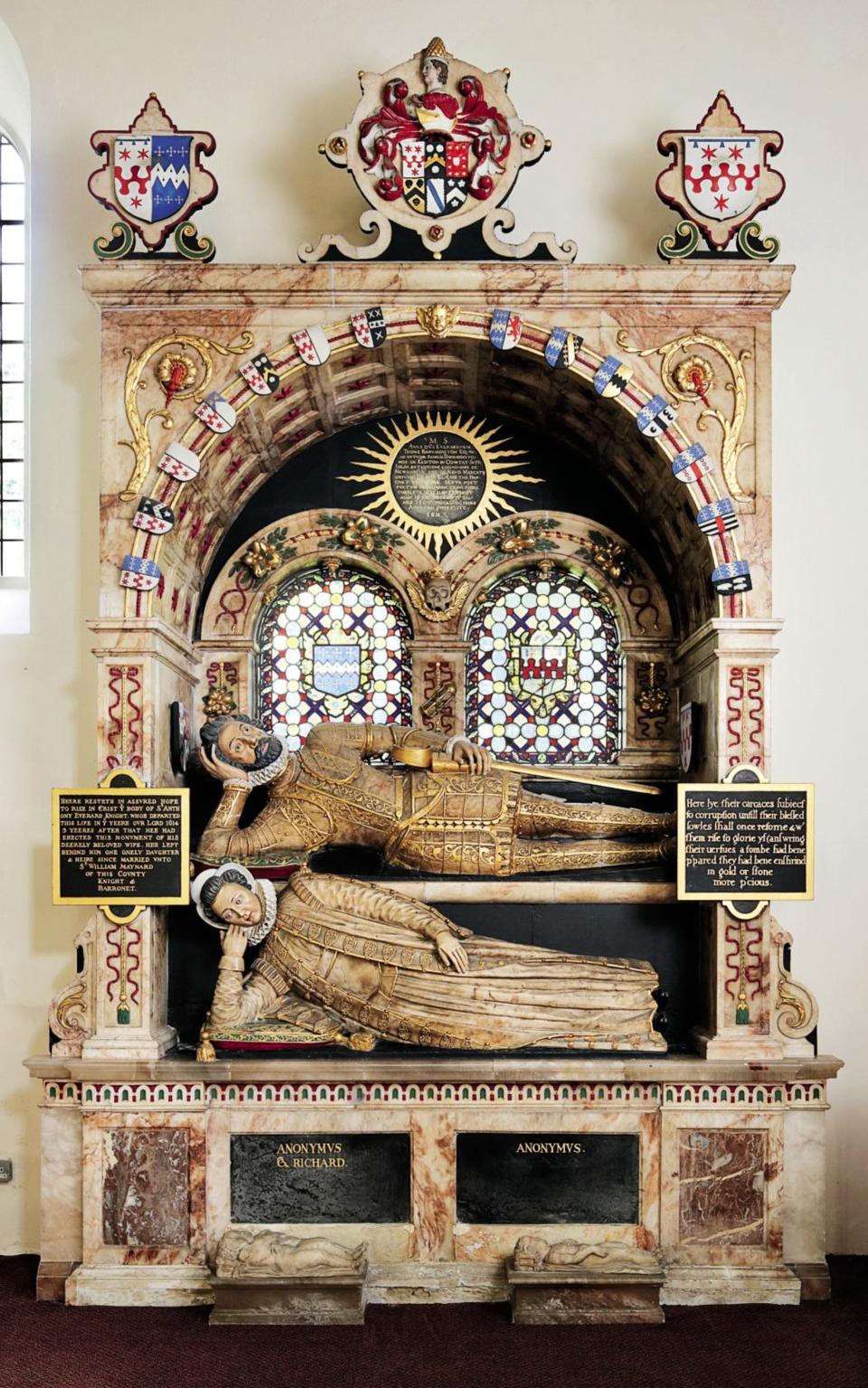 Together forever: this colourful monument was erected at Great Waltham, Essex, in 1611 by Sir Anthony Everard (top deck) to his first wife, Ann (beneath), who died in childbirth - CB Newham