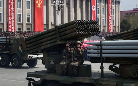 North Korean soldiers man a missile rocket launcher during mass military parades in Pyongyang - Credit: ED JONES/AFP/Getty Images