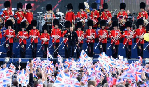 British singer-songwriter Robbie Williams performs on stage during the Queen's Diamond Jubilee Concert at Buckingham Palace in London on June 4, 2012