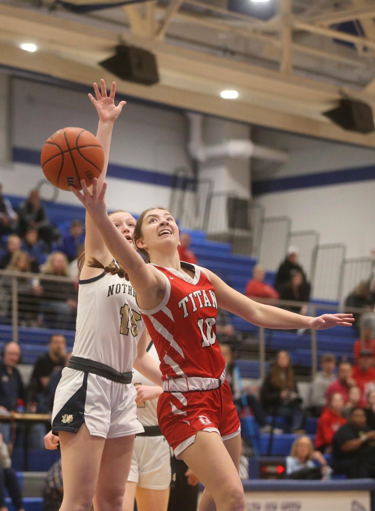 Chatham Glenwood's Makenna Yeager attempts a layup against Quincy Notre Dame in the Class 3A Decatur MacArthur Sectional final on Thursday, Feb. 22, 2024. Glenwood won 44-43.