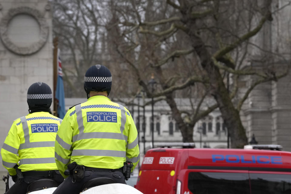 Police officers ride in Westminster in London, Tuesday, March 21, 2023. An independent review says London police have lost the confidence of the public because of deep-seated racism, misogyny and homophobia. The report released Tuesday was commissioned after a young woman was raped and killed by a serving officer. (AP Photo/Kirsty Wigglesworth)