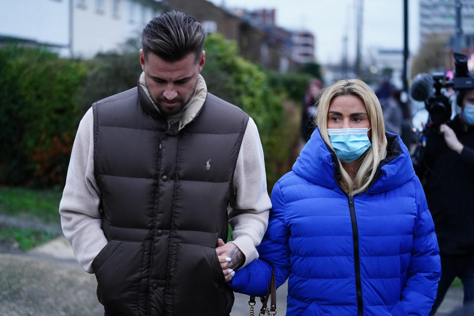 Katie Price with Carl Woods leaving Crawley Magistrates' Court in West Sussex after she was handed a 16-week suspended jail sentence for drink-driving while disqualified and without insurance following a crash near her home in Sussex. The former glamour model, 43, was also banned from driving for two years over the collision on the B2135 near Partridge Green on September 28. Picture date: Wednesday December 15, 2021.