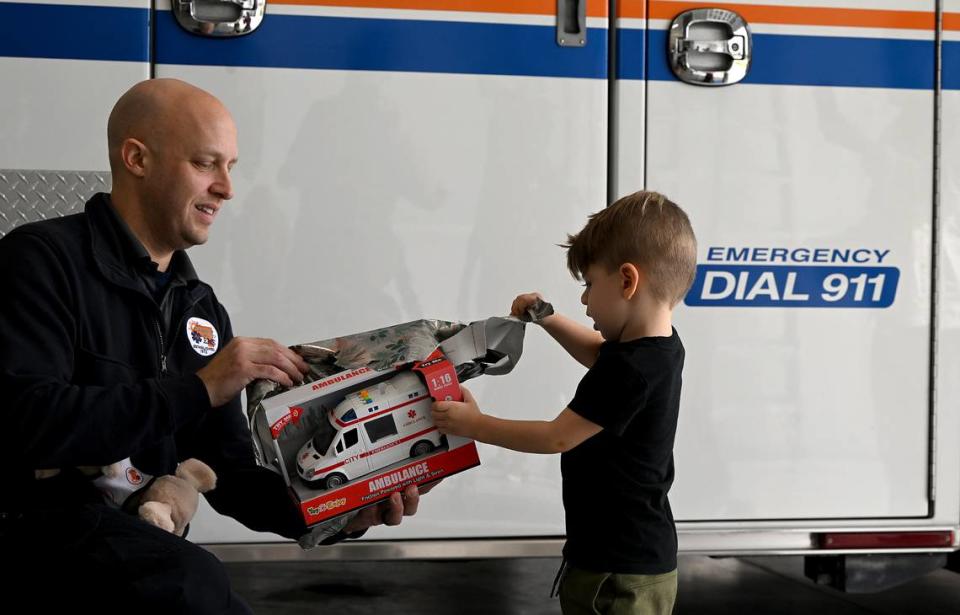 Nolan Backus, 2 1/2, plays with a toy ambulance he received as a gift when meeting the Manatee County charge paramedic Kevin Guido who treated him in an ambulance after he suffered a seizure at his daycare in March.