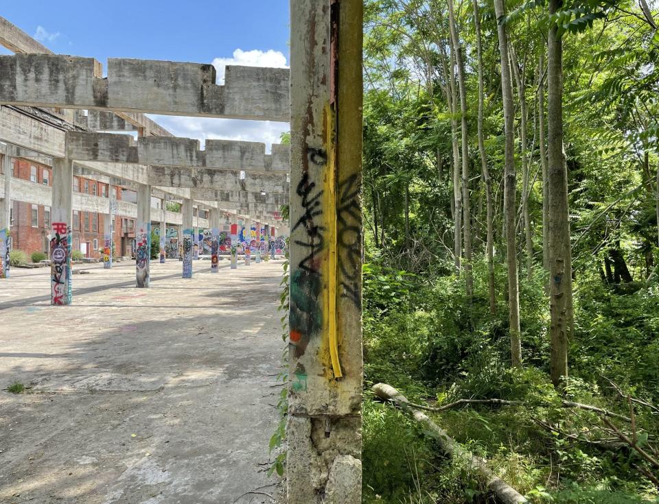 This scene from Ruins Hall in Glen Rock brings together the natural setting on which this former industrial building was constructed, the remains of that building and the work of artists who have added to this event venue. To add to the scene, Northern Central Railway trains, an excursion service, roll nearby on the old line by that name. That line serviced factories such as that now covered by Ruins Park. This picture is part of a current art exhibit at the Gallery at the Old Post Office in Hanover.