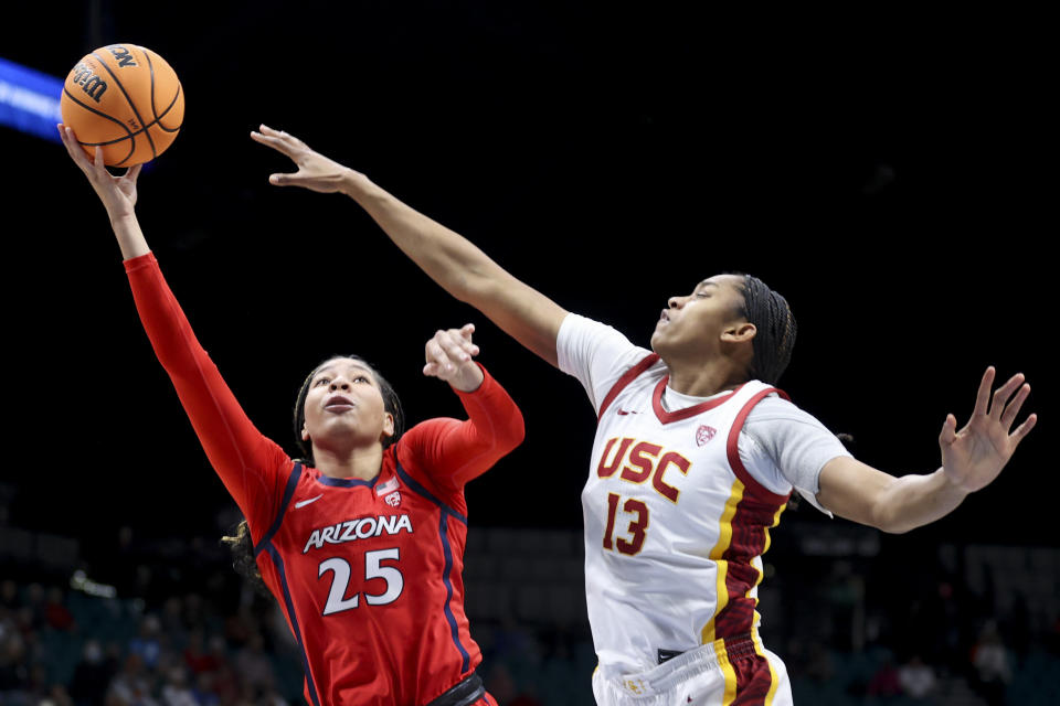 Arizona forward Breya Cunningham (25) shoots over Southern California center Rayah Marshall (13) during the first half of an NCAA college basketball game in the quarterfinal round of the Pac-12 tournament Thursday, March 7, 2024, in Las Vegas. (AP Photo/Ian Maule)