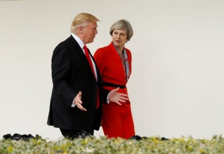FILE PHOTO: U.S. President Donald Trump escorts British Prime Minister Theresa May down the White House colonnade after their meeting at the White House in Washington, U.S., January 27, 2017. REUTERS/Kevin Lamarque/File Photo