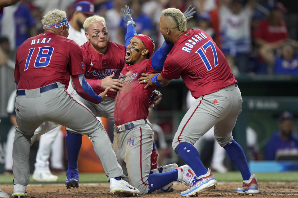 Puerto Rico won a de facto elimination game against the Dominican Republic on Wednesday in the World Baseball Classic.  (AP Photo/Wilfredo Lee)