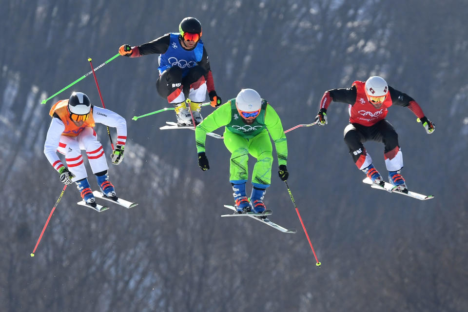 <p>Armin Niederer of Switzerland, Filip Flisar of Slovenia, Thomas Zangerl of Austria and Jonas Lenherr of Switzerland compete in the Freestyle Skiing Men’s Ski Cross Quarterfinals on day 12 of the PyeongChang 2018 Winter Olympic Games at Phoenix Snow Park on February 21, 2018 in Pyeongchang-gun, South Korea. (Photo by Quinn Rooney/Getty Images) </p>