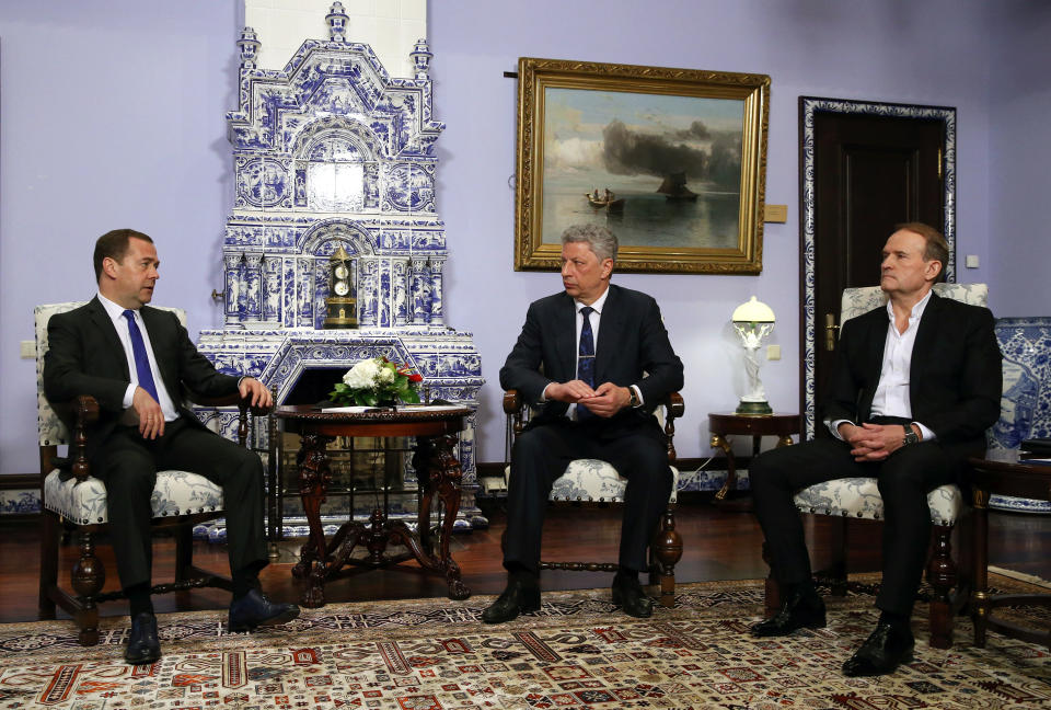 Russian Prime Minister Dmitry Medvedev, left, talks with Ukrainian presidential candidate Yuri Boyko, center, and Ukrainian politician Viktor Medvedchuk during their meeting in Moscow, Russia, Friday, March 22, 2019. A Ukrainian presidential candidate has traveled to Moscow to meet with the Russian prime minister to discuss gas supplies. (Yekaterina Shtukina, Sputnik, Government Pool Photo via AP)