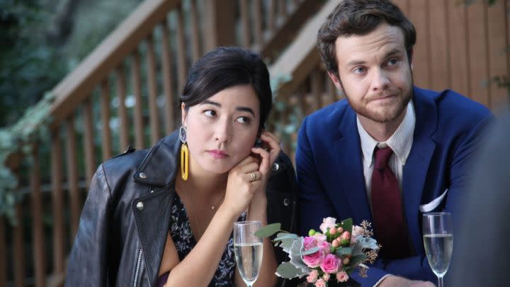 Maya Erskine and Jack Quaid as Alice and Ben at a wedding in the film Plus One.