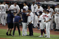 Cleveland Indians manager Terry Francona, left, hugs Indians pitcher Carlos Carrasco during the middle of the fifth inning of the MLB baseball All-Star Game, Tuesday, July 9, 2019, in Cleveland. The Indians' right-hander, who was recently diagnosed with a form of leukemia, was saluted in the fifth inning of the game as part of Major League Baseball's "Stand Up to Cancer" campaign. (AP Photo/Ron Schwane)