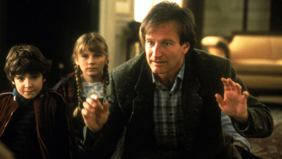 Kirsten Dunst, Robin Williams in <em>Jumanji</em> (1995).