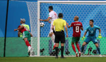 Soccer Football - World Cup - Group B - Morocco vs Iran - Saint Petersburg Stadium, Saint Petersburg, Russia - June 15, 2018 Morocco's Aziz Bouhaddouz scores an own goal and the first goal for Iran REUTERS/Pilar Olivares