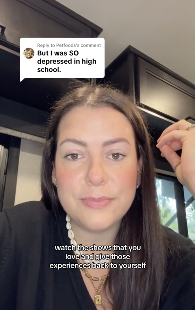 Nikki in a video still with text about watching shows you loved and giving those experiences back to yourself