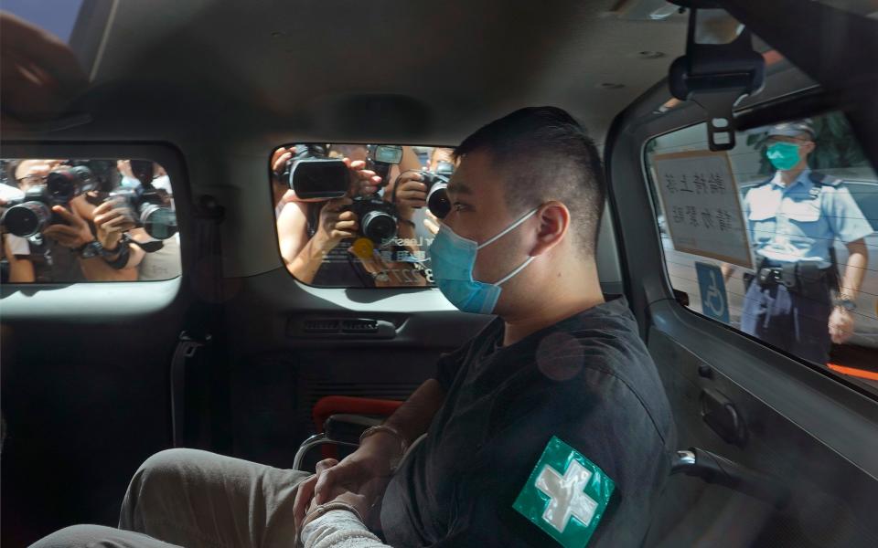 Tong Ying-kit arriving at a court in a police van shortly after being arrested in July 2020 - Vincent Yu /AP