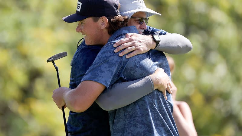 Bonneville’s Parker Bunn gets a hug after finishing the 5A boys state golf championship at Fox Hollow Golf Club in American Fork on Tuesday, Oct. 10, 2023. Bunn tied for first and then won in a playoff.